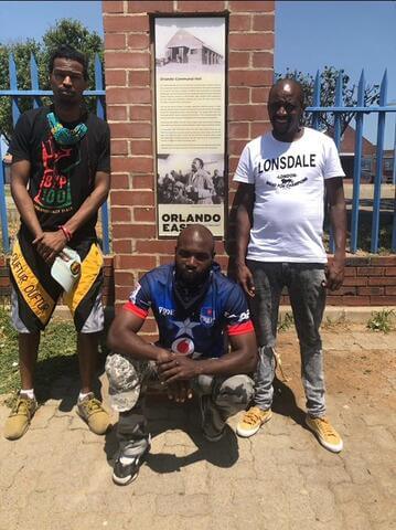 DaQuan Lawrence, Ali Muhammad, and Hlatshwayo at the Orlando Communal Hall building in Soweto, Johannesburg, South Africa, where Robert Sobukwe and other frustrated Africanists split from the ANC